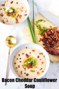 two bowls filled with soup and topped with bacon