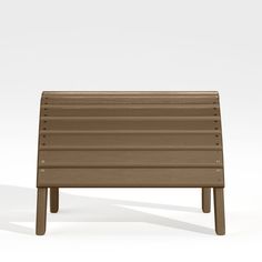 a brown bench sitting on top of a white floor