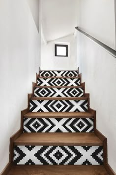 the stairs are decorated with black and white designs