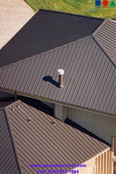 an aerial view of a house with metal roofing