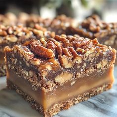 two pieces of pecan bar stacked on top of each other