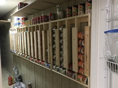 the shelves are filled with canned food items