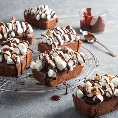 chocolate desserts with marshmallow toppings on a wire rack