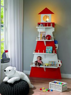 a child's room with a red and white tree shelf next to a teddy bear