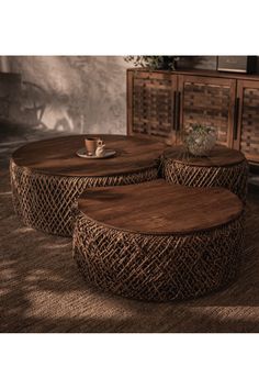 two coffee tables sitting on top of a rug