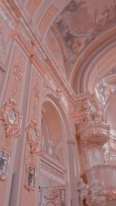 an ornately decorated room with pink walls and ceilings