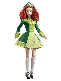 a doll with red hair wearing a green dress and white socks is standing in front of a white background