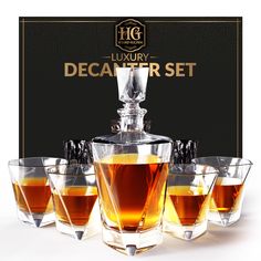 the luxury decanter set is filled with four glasses