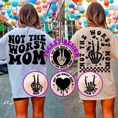 two women wearing matching shirts with the words not the worst mom and hand prints on them