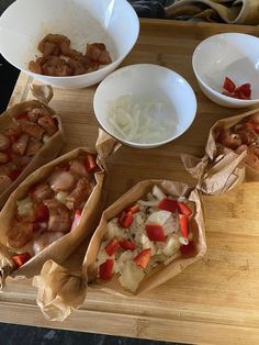 some food is laying out on a cutting board and ready to be cooked in the oven