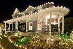 a house with christmas lights on the front porch