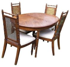 a wooden table with four chairs around it