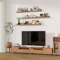 【Minimalist modern design】Different colors and multiple sizes make this shelf perfect for any home decor, whether it is modern or farmhouse decor, it can create a chic wall effect. Each wall shelf in this set of wall shelves can be placed alone or as a symmetrical gallery display Latitude Run® Color/Finish: Natural Wood, Size: 2" H x 16" W x 5.7" D | Latitude Run® Floating Shelves Set Of 3, Picture Ledge Shelf, Floating Shelves For Wall | 2" H x 16" W x 5.7" D | Wayfair | Home Decor Offset Floating Shelves, Floating Shelf Living Room, Floating Shelves With Lip, Shelf For Room, Shelves In The Bathroom, Wood Picture Ledge, Shelves With Lip, Living Room Books, Wall Floating Shelves