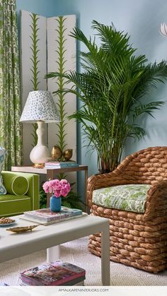 a living room filled with furniture and plants