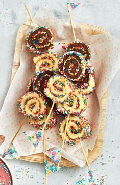 several donuts with sprinkles are on a plate