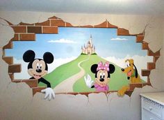 a mickey mouse mural on the side of a wall in a child's room