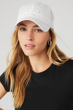 Top off your look with Alo's limited edition, fresh take on the classic dad cap. This street style must-have features our signature logo and the adjustable velcro strap back makes this piece fit for everybody. Sporty Everyday Snapback Baseball Cap, Trendy White Hats For Streetwear, Trendy White Hat For Streetwear, Trendy White Curved Bill Hat, Trendy White Streetwear Hat, Trendy White Hats With Curved Visor, Trendy White Hat With Curved Visor, Trendy White Hat With Curved Bill, Sporty Everyday Baseball Cap With Curved Bill