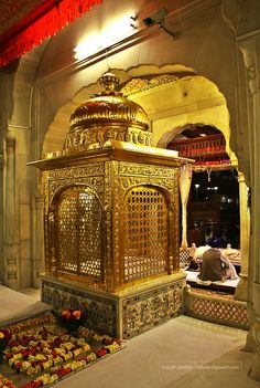 an elaborately decorated shrine in the middle of a building