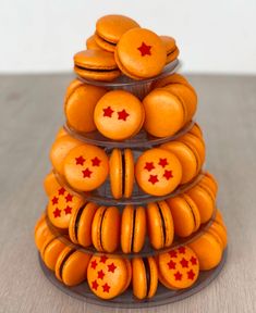 a stack of orange macaroons with red stars on them