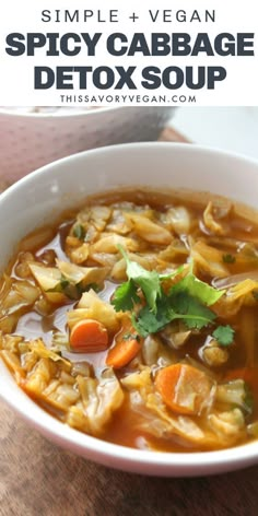 a white bowl filled with soup on top of a wooden table