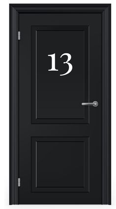 a black door with the number 13 on it's side and an arrow in the middle