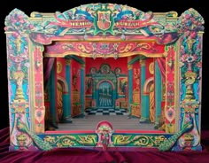 an elaborately decorated photo frame on a red cloth