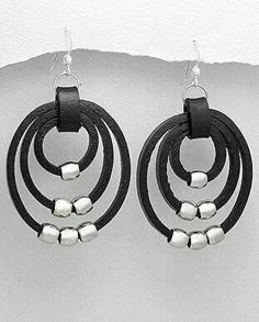 pair of black leather earrings with silver beads