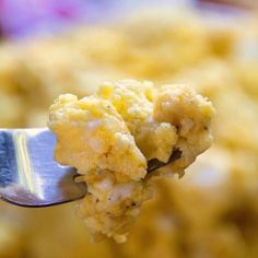 a close up of a spoon with food on it's fork in the bowl