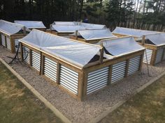 a group of metal buildings with lots of windows