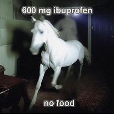 a white horse is galloping in the dark with words above it that read 600mg iuproten no food