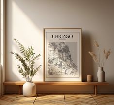 a chicago map is displayed on a shelf next to two vases and a plant