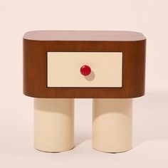 two white and brown tables with red knobs on each one's sides, side by side