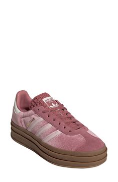 A triple-stacked platform elevates a time-tested sneaker, while serrated side stripes and a Trefoil-embossed sole keep it close to its roots. Lace-up style Leather and textile upper/textile lining/rubber sole Imported Adidas Gazelle Bold, Gazelle Bold, Velvet Pink, Platform Sneaker, Adidas Gazelle, Side Stripe, Up Styles, Womens Sneakers, Rubber Sole