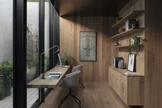 a home office with wooden walls and flooring