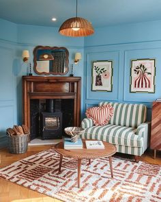 a living room filled with furniture and a fire place next to a wooden burning stove