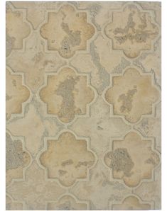 a beige rug with an intricate design on the top and bottom side, in different colors