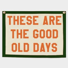 there are the good old days sign in orange and green on a white background with black border