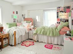 a bedroom with two twin beds and lots of pillows