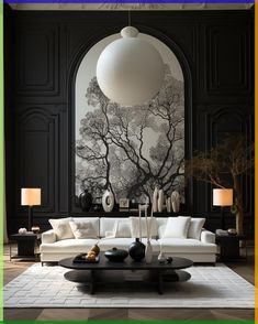 a living room with black walls and white furniture in front of a large painting on the wall