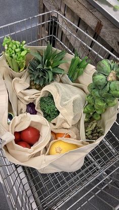 a shopping cart filled with fruits and vegetables