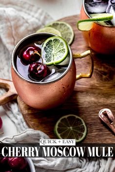 two copper mugs filled with cherries and lime slices