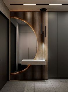 a bathroom with a mirror, sink and lights on the wall next to each other