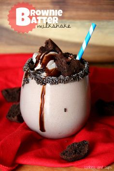 there is a milkshake with chocolate and marshmallows in it