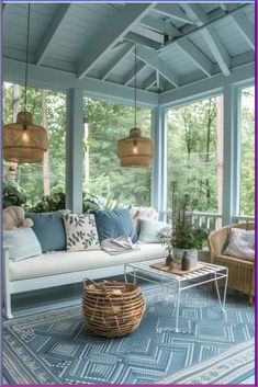 a living room filled with lots of furniture and plants on top of a blue rug