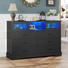 an aquarium is on top of a dresser