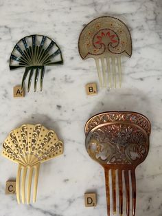 These exceptional decorative hair combs come from the estate of a woman who loved elaborate hair combs.  The colours are fabulous.  These outstanding examples are made of celluloid and further embellished with coloured rhinestones.  They are all in excellent condition and come from the art deco period. Comb D has one frond that is shorter than the other fronds and has a swirl missing from the inside (see close up photos) Measurements are in photos  The price is for one comb. Please indicate whic Decorative Hair Combs, Hair Combs, Art Deco Period, Close Up Photos, Hair Comb, Comb, Swirl, Close Up, A Woman