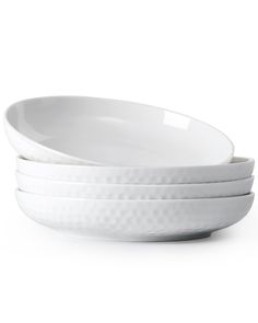 three white bowls stacked on top of each other