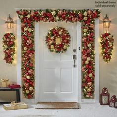 a christmas door decorated with red and gold ornaments, wreaths and presents on the floor