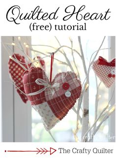 two hearts hanging from a tree with text overlay that reads quilted heart free pattern