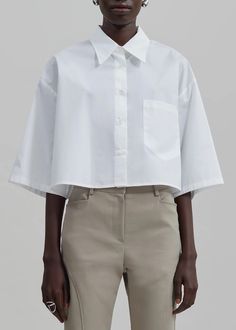 Odem Cropped Shirt - White – The Frankie Shop Cropped Collard Shirt Outfits, White Cropped Button Up Shirt Outfit, Crop Button Up Shirt, Oversized Cotton Cropped Shirt Casual, Oversized Cotton Casual Cropped Shirt, Cropped Button Up Shirt Outfit, Luxury Casual Button-up Cropped Shirt, Chic Cropped Button-up Shirt With Pockets, White Button-up Cropped Shirt For Daywear